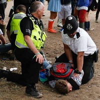 police restraining festival goer