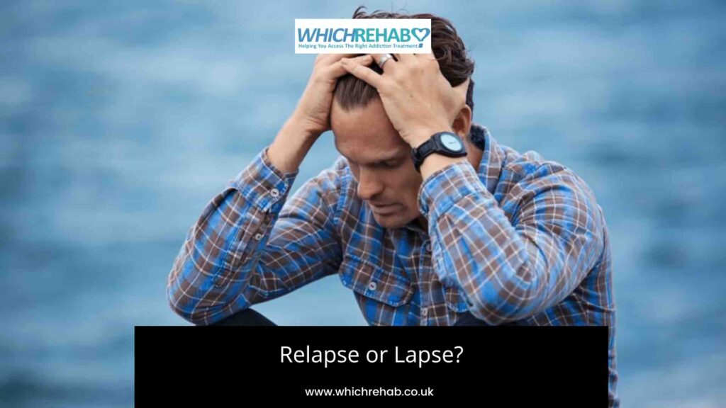 A man holding his head in his hands by the ocean - Relapse or lapse blog - Which rehab