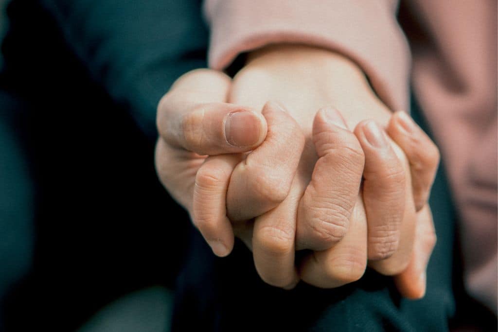 Hand holding to support mental health issues - Which Rehab