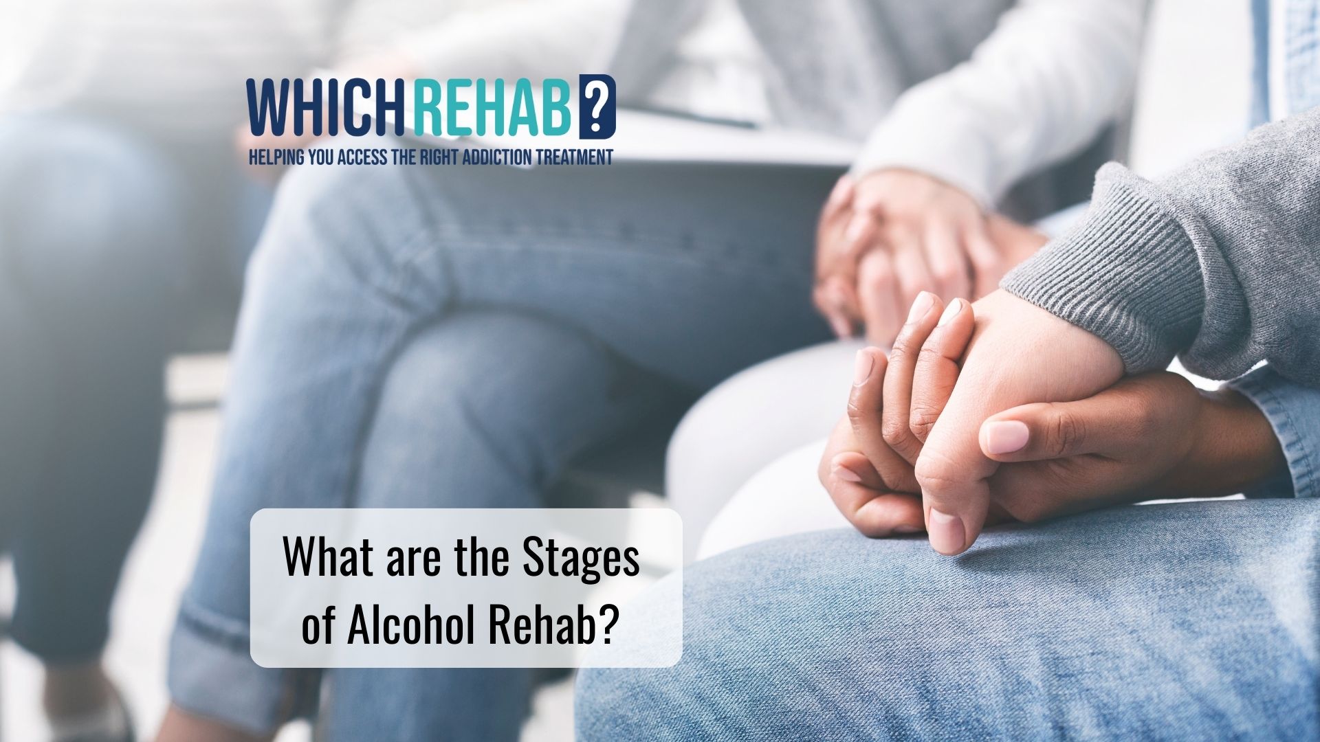 Two patients holding hands in a group alcohol addiction therapy session - What are the stages of alcohol rehab blog - Which Rehab