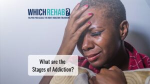 A woman suffering from addiction - What are the stages of addiction - Which Rehab